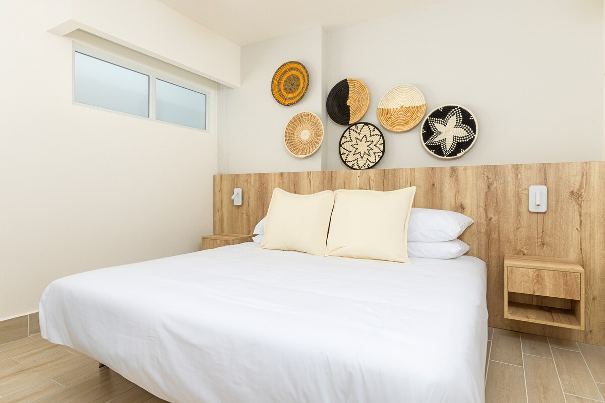 Bedroom three-quarter view showing wardrobe and decor in Penthouse 900-7