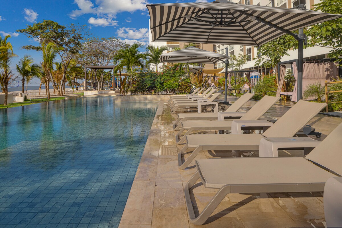 Resort pool and sun deck at Playa Caracol