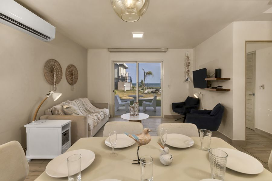 Living and dining area with ocean view in Villa C13-PBB