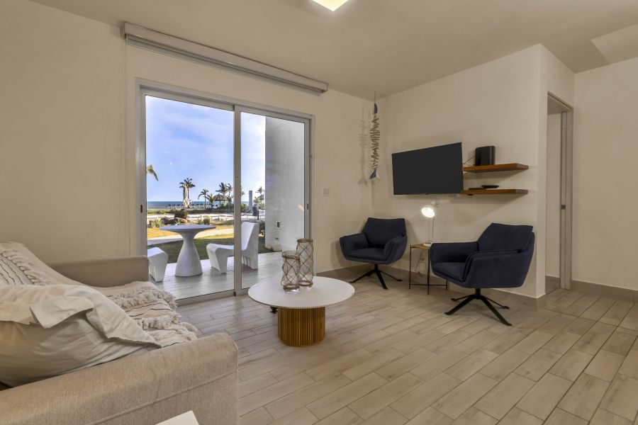 Living area with ocean view through sliding door