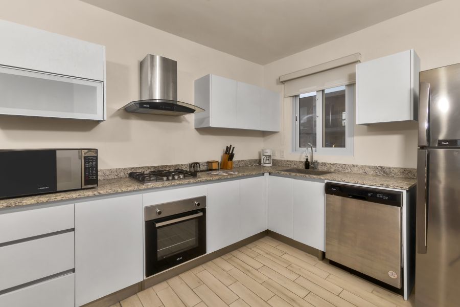 Kitchen with granite countertops and stainless steel appliances in Villa C13-PBB
