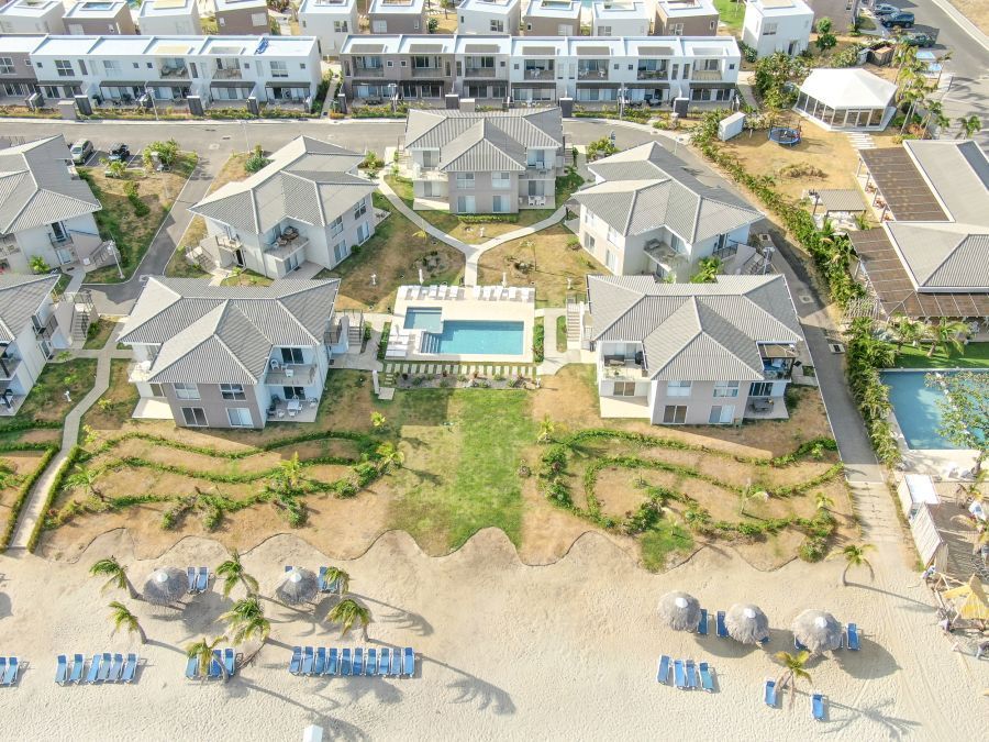 Aerial drone view of the Residences villa complex and pool