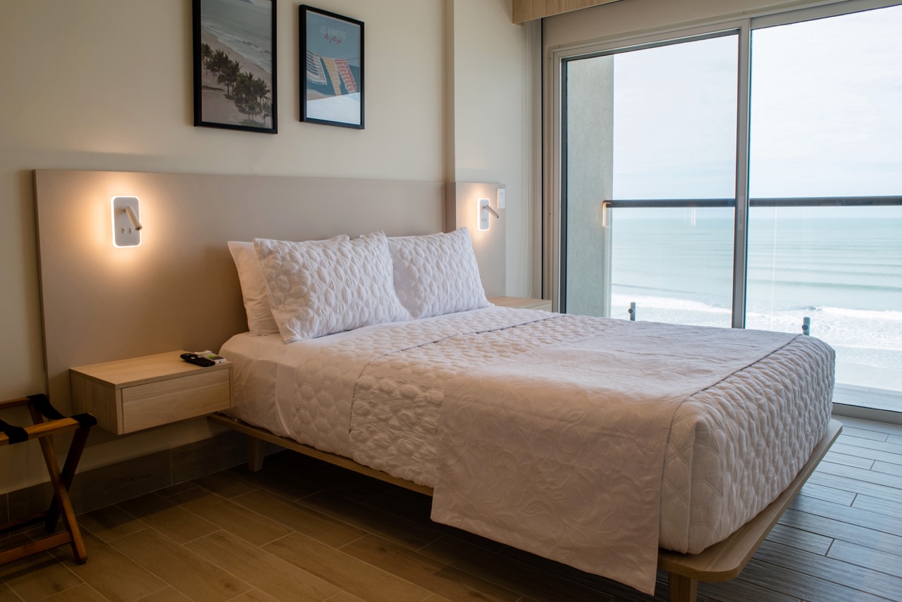 Bedroom with ocean view in Radisson Suite 502a at Playa Caracol